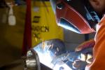 Image of a worker welding