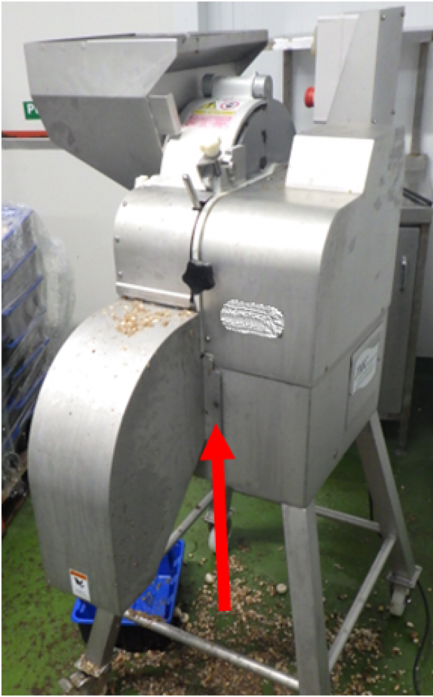 Figure 2: Dicing machine and area highlighted where thumb screw was used on a fixed guard.