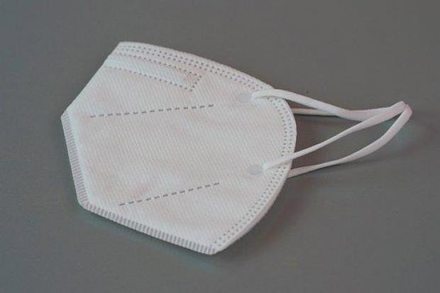 Image of white respirator face mask with ear loops